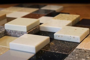 Top view of color samples stone  on oak wood table, Acrylic Solid Surface