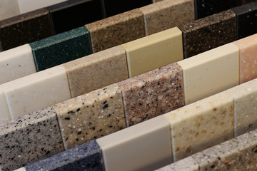 Top view of color samples stone  on oak wood table, Acrylic Solid Surface