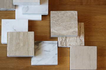 color samples of marble  on oak wood table, material for interior designer