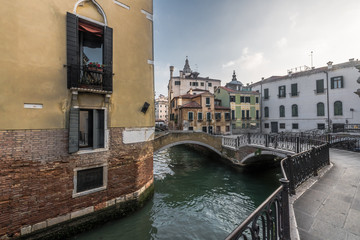 Fototapeta na wymiar Crossroads of narrow canals in Venice