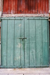 Wooden door, dark green, antique style.