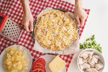 woman hands cooking pizza on white table top view flat lay