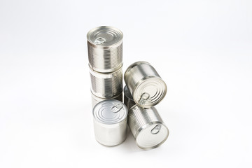 Group of silver canned food on white background.