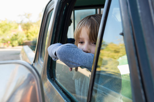 6 year old boy  in 1970's era pick up truck