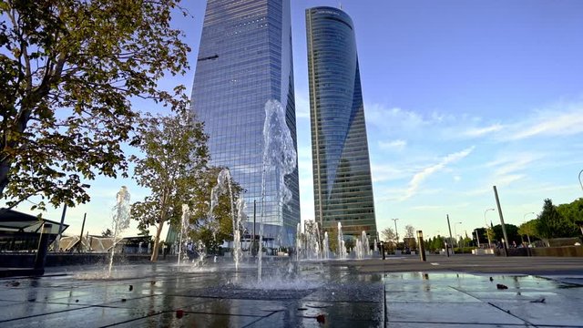 Water Jets founta in front of the skyscrapers or Cuatro Torres in Madrid financial district, Spain. Slowmotion footage from original 120fps video.
