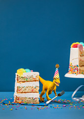 Dinosaur and slice of Birthday Cake