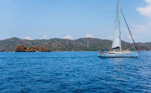 ship white sails a yacht in the Aegean Sea