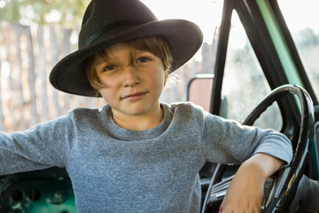 6 year old boy  in 1970's era pick up truck