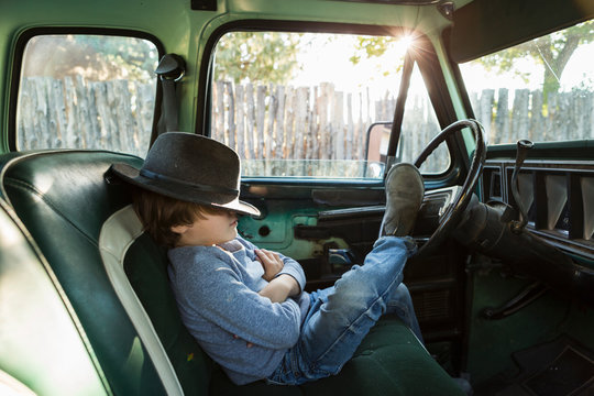 6 year old boy  in 1970's era pick up truck