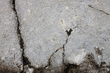 cracked dirty stone wall, concrete wall brocken and weathered 