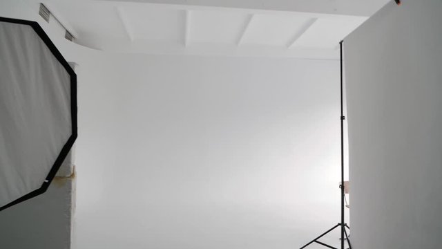 Professional photo studio with a large white cyclorama