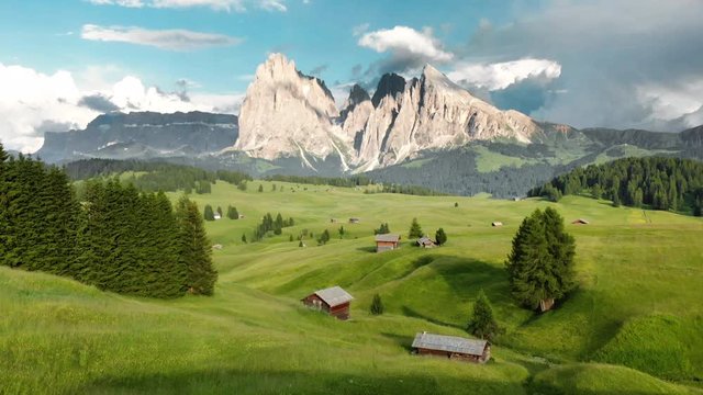 Scenic alpine mountain scenery in the Alps with cabins in summer