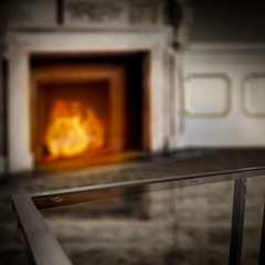 Table background of free space for your decoration and home interior with fireplace 
