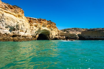 Fototapeta na wymiar Landscape of Algarve coastline has many sea caves inside the cliffs overlooking the Atlantic Ocean, Portugal