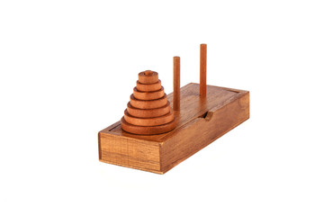 Wooden puzzle tower of hanoi over white background.