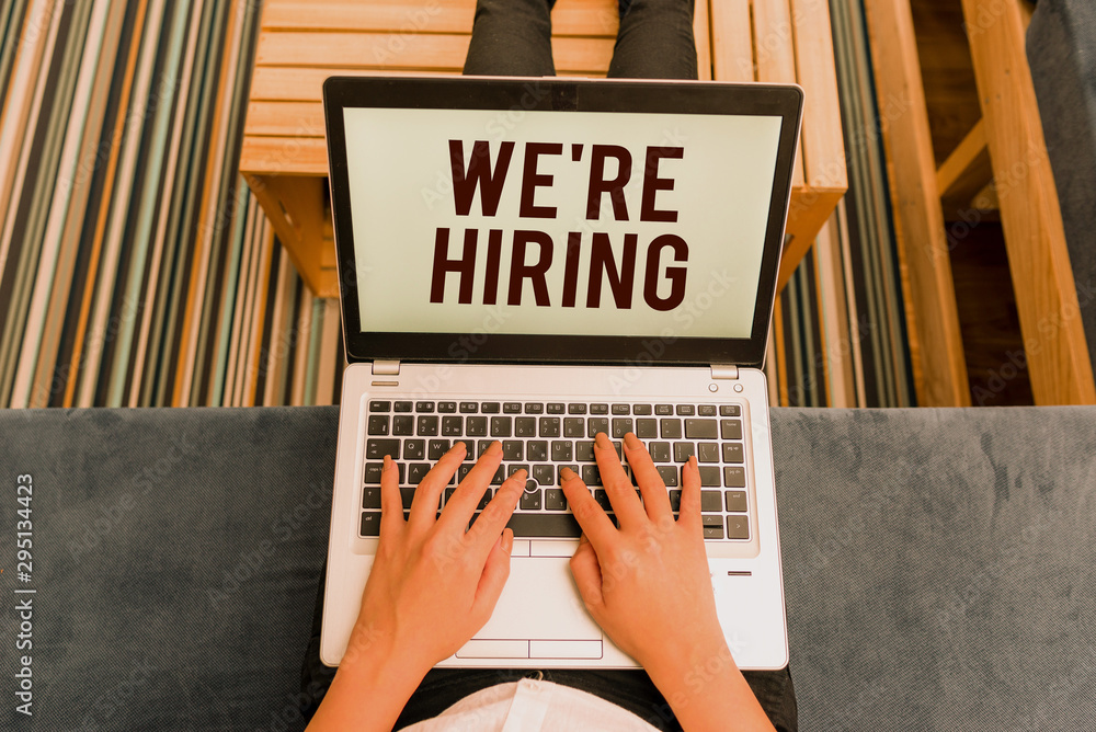 Poster writing note showing we are re hiring. business concept for process of reviewing applications and fi