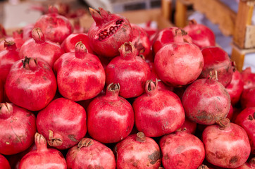  Organic, fresh, red garnet from farmers market. Vitamin healthy food ready to eat. Garnet antioxidant organic superfood concept for healthy eating and nutrition