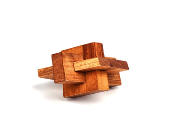 Wooden constructor puzzle oblique knot over white background.