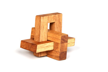Wooden constructor puzzle oblique knot over white background.