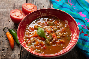Mexican style lentil soup with tomato and nopal cactus