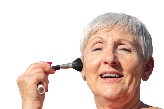 Smiling Older Woman With White Hair Putting On Makeup