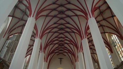 Christian Catholic St. Thomas Church (Thomaskirche) interior in Leipzig, Germany, Europe. Remains of Johann Sebastian Bach are here. 4K Background Tilt Low Angle Indoor Shot
