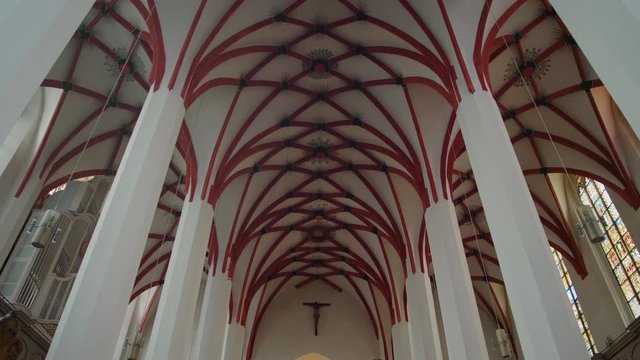 Christian Catholic St. Thomas Church (Thomaskirche) interior in Leipzig, Germany, Europe. Remains of Johann Sebastian Bach are here. 4K Background Tilt Low Angle Indoor Shot