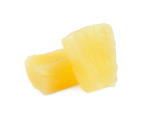 Pieces of delicious sweet canned pineapple on white background