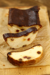 Slice of curd pudding on cutting board