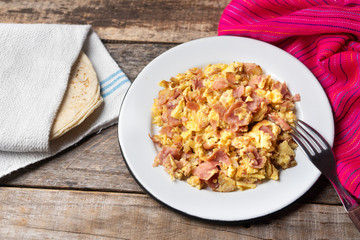 Tradtional scrambled eggs with ham breakfast
