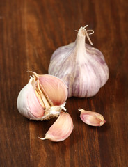 Garlic bulbs and cloves on wooden table
