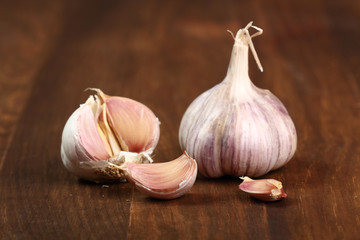 Garlic bulbs and cloves on wooden table