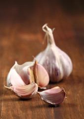 Garlic bulbs and cloves on wooden table