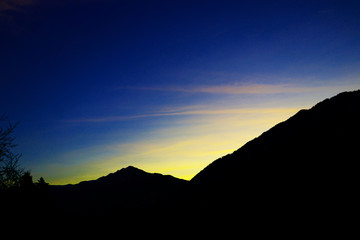 Sun rising behind the mountain