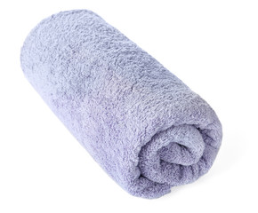 Rolled clean lilac towel on white background
