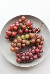 grapes on a plate with water droplets