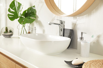 Fototapeta na wymiar Stylish bathroom interior with vessel sink and decor elements