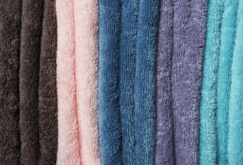 Different soft terry towels as background, closeup