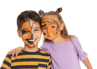 Cute little children with face painting on white background