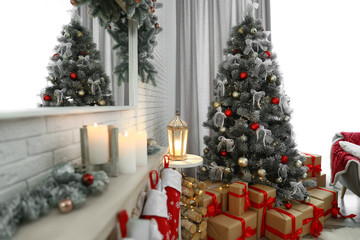 Beautiful decorated Christmas tree in living room interior