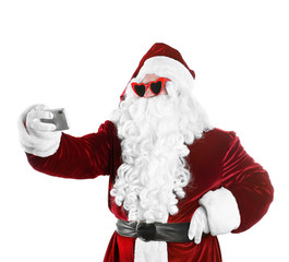 Authentic Santa Claus taking selfie on white background