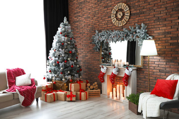 Stylish room interior with beautiful Christmas tree