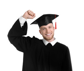 Happy student wearing graduation hat on white background