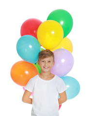 Fototapeta na wymiar Little boy holding bunch of colorful balloons on white background