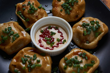 Roasted pork bun serving with dipping sauce