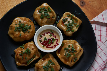 Roasted pork bun serving with dipping sauce