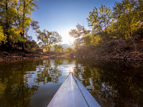 Paddling Kayak On Mountain Lake