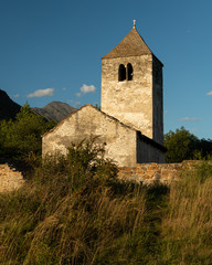 Old chapel St. Sisinius in Laas on a sunny evening in summer