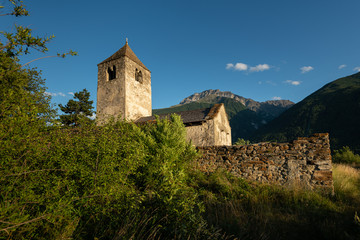 Old chapel St. Sisinius in Laas on a sunny evening in summer