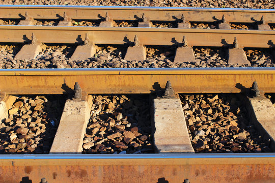 Railroad tracks close in parallel
